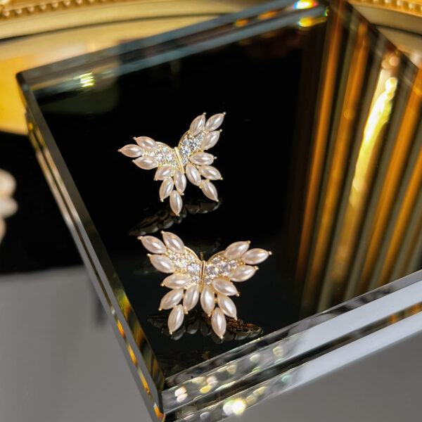 Сережки "Метелики" з перлами та стразами (7439)