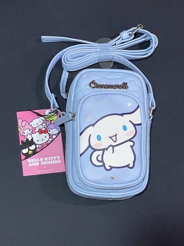 1f3674dd-5a52-4313-a7cd-40356dbb26cf.jpg Сумочка для телефону/гаманець 2 в 1 "Hello Kitty/Cinnamoroll" Primark блакитна