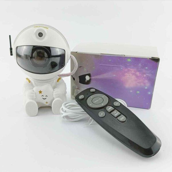 31eb850d-3621-4df1-b1d7-58c1becbc274.jpg Нічник проектор зоряного неба "Астронавт/Космонавт з зіркою" Міні лазерний світильник з пультом