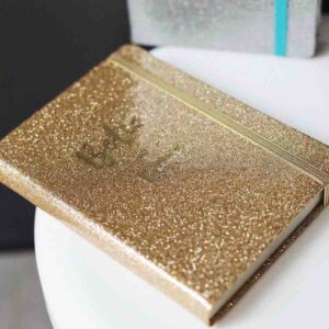 Блокнот А6 на гумці, 144 аркуші, золотий  з глітером