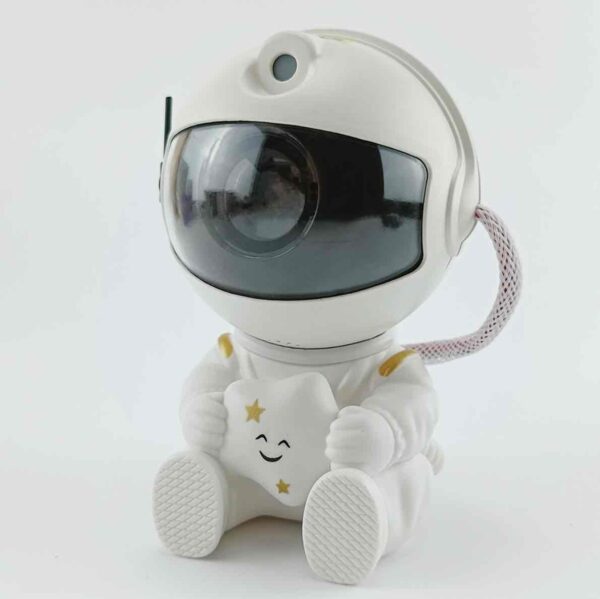 b247dbda-2732-4cdd-a7ae-c64aeed92b06.jpg Нічник проектор зоряного неба "Астронавт/Космонавт з зіркою" Міні лазерний світильник з пультом