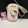 d797b5d6-5fb7-48ed-a121-d663ad6d2528.jpg Сумочка для телефону "Hello Kitty" Primark еко-шкіра біла