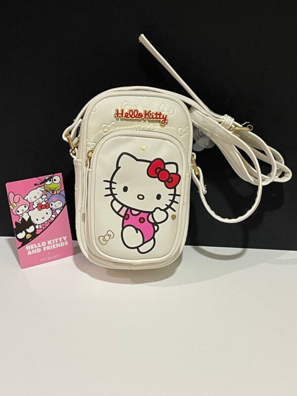 d797b5d6-5fb7-48ed-a121-d663ad6d2528.jpg Сумочка для телефону "Hello Kitty" Primark еко-шкіра біла