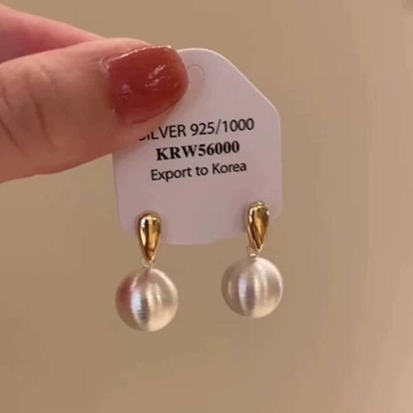 Сережки металеві "Кульки" срібні з золотим (10535)