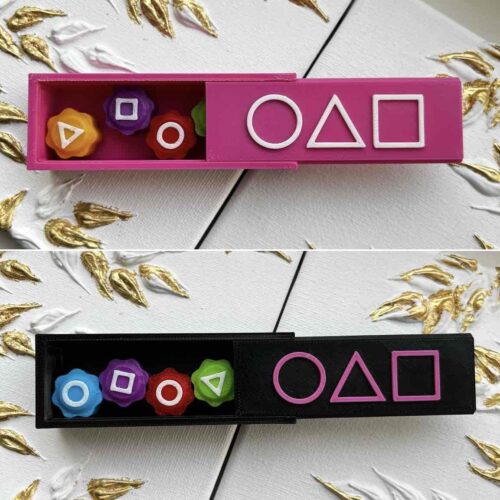 4c422572-3448-4b35-b220-6df6dd2ba097.jpg Гра настільна «Гонгі/ Gonggi Гра в Кальмара» в прямокутній коробці чорна/рожева