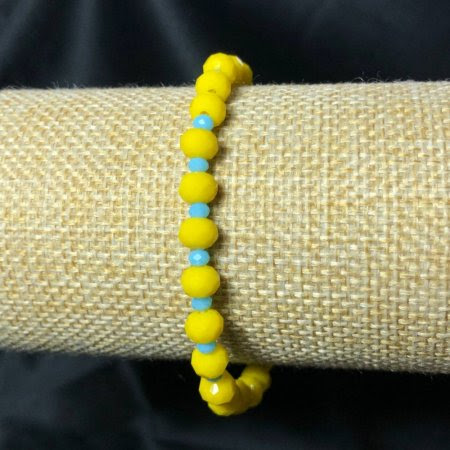 Браслет натур. Чеський кришталь синьо-жовтий 6х4 мм стрейч (патріотичний)