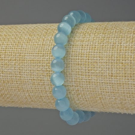 faf9885e-b08e-45ef-8547-3a8974659df0.jpg Браслет Котяче око блакитне кулька 8 мм стрейч