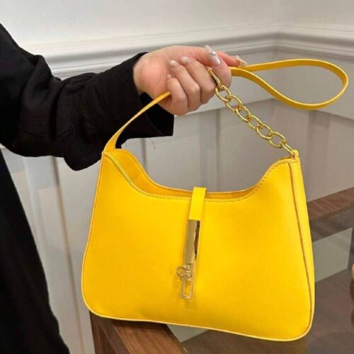 Сумочка з пряжкою жовта