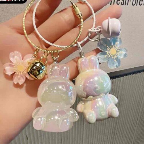 893a1030-1b44-48ab-a67e-b067e3f3d6ff.jpg Брелок "Зайчик" райдужний з аксесуарами